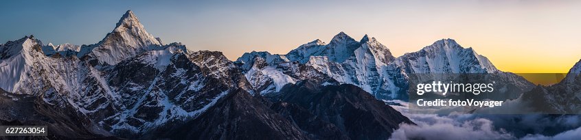 Alpenglow on dramatic mountain peaks panorama Ama Dablam Himalayas Nepal Alpenglow on dramatic mountain peaks panorama Ama Dablam Himalayas Nepal