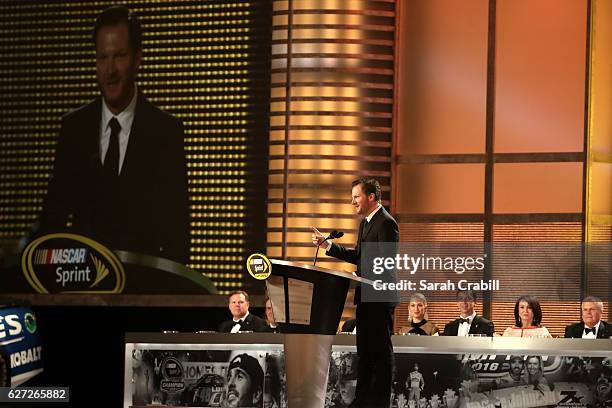 Driver Dale Earnhardt Jr. Speaks on stage after receiving the NMPA Sprint most popular driver award during the 2016 NASCAR Sprint Cup Series Awards...