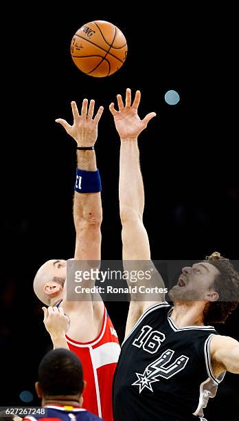 Pau Gasol of the San Antonio Spurs jumps against Marcin Gortat of the Washington Wizards at AT&T Center on December 2, 2016 in San Antonio, Texas....