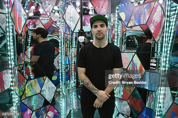 Artist ThankYouX creates a digital live art piece using Samsung Galaxy Tab S2 at the Samsung 360û Photo Booth at Soho Beach House during Art Basel on...