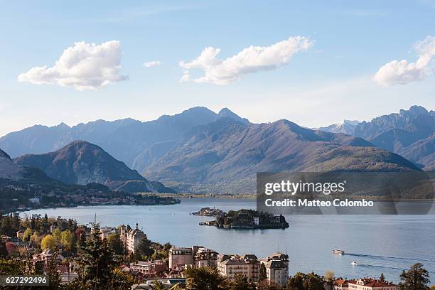 borromean islands and mountains, lake maggiore, italy - baveno foto e immagini stock