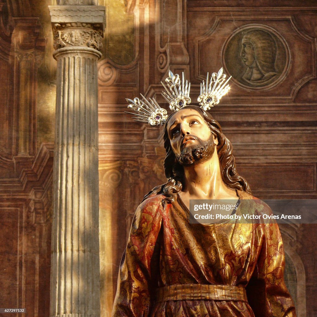 Sculpture of the Passion of Jesus and frescoes of the outer facade of the church of Santo Domingo in the Realejo neighbourhood, Granada, Andalusia, Spain