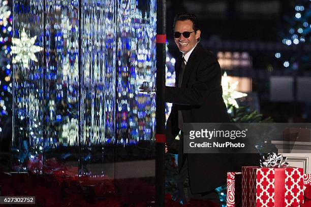 Artist Marc Anthony, makes his way to the stage to perform at the 94th Annual National Christmas Tree lighting ceremony at the Ellipse near the White...