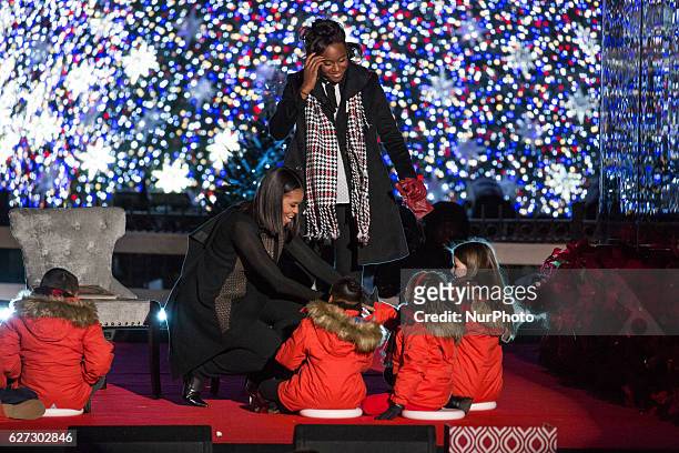 , First Lady Michelle Obama, and Olympic medalist Simone Manuel, read a Christmas story to kids at the 94th Annual National Christmas Tree lighting...