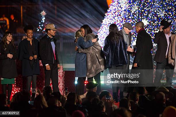 President Barack Obama and the first family, join the featured performers onstage at the end of the 94th Annual National Christmas Tree Lighting...