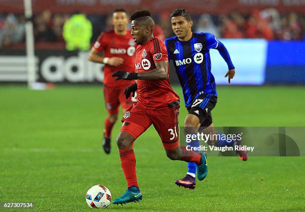 Armando Cooper of Toronto FC dribbles the ball during the second half of the MLS Eastern Conference Final, Leg 2 game against Montreal Impact at BMO...