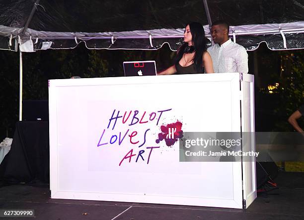 Michelle Pooch and DJ Sandman at the Hublot after party on December 2, 2016 in Miami Beach, Florida.