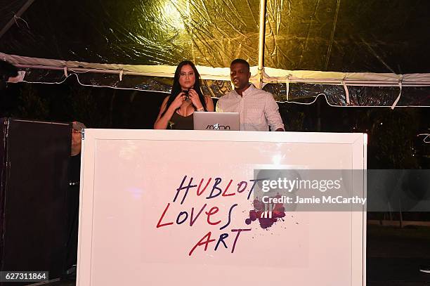 Michelle Pooch and DJ Sandman at the Hublot after party on December 2, 2016 in Miami Beach, Florida.