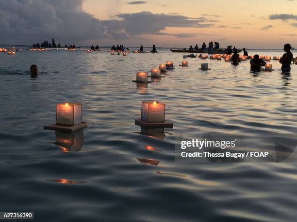 memorial day celebrations - floating lanterns stock-fotos und bilder