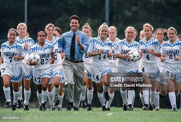 Coach Anson Dorrance poses with the University of North Carolina Tar Heels women's soccer team while training on September 24, 1994 at Saint Mary's...