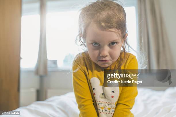 sulking young girl - stirn runzeln stock-fotos und bilder
