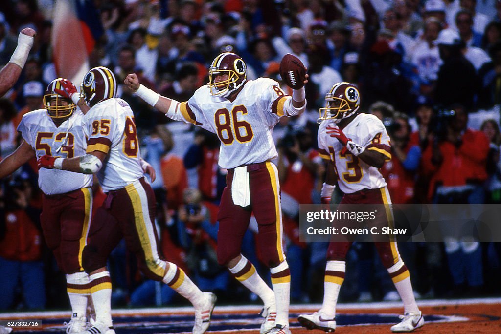 Ed Rubbert Clint Didier of the Washington Redskins circa 1987 celebrates TD in ...