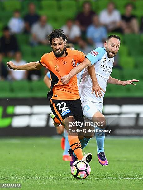 Thomas Broich of Brisbane Roar and Joshua Rose of the City compete for the ball during the round nine A-League match between Melbourne City FC and...