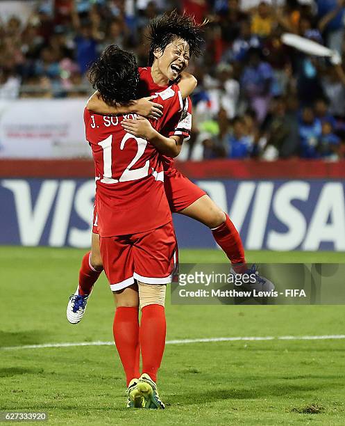 Jon So Yon of Korea DPR is congratulated on her goal during the FIFA U-20 Women's World Cup Papua New Guinea 2016 Final between Korea DPR and France...