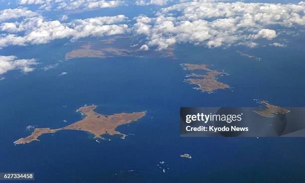Photo taken Dec. 3 from a Kyodo News airplane shows Habomai islet group, one of four Russian-held, Japan-claimed islands off Japan's northernmost...