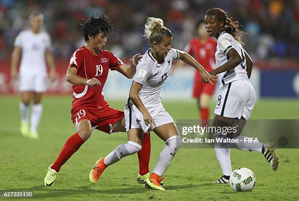 Ju Hyo Sim of Korea DPR tries to tackle Juliane Gathrat of France during the FIFA U-20 Women's World Cup, Final match between Korea DPRand France at...