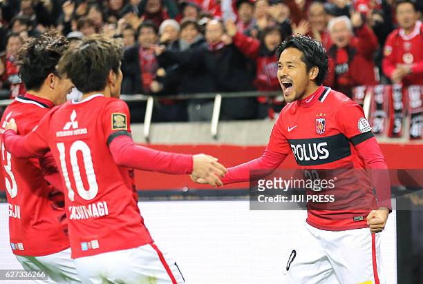 Shinzo Koroki of Urawa Reds celebrates his goal with teammates during the J-League Championship final match against Kashima Antlers in Saitama on...