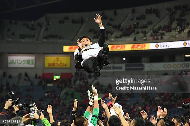 Manager Masatada Ishii of Kashima Antlers is tossed into the air by players after winning the J.League Championship after the J.League Championship...