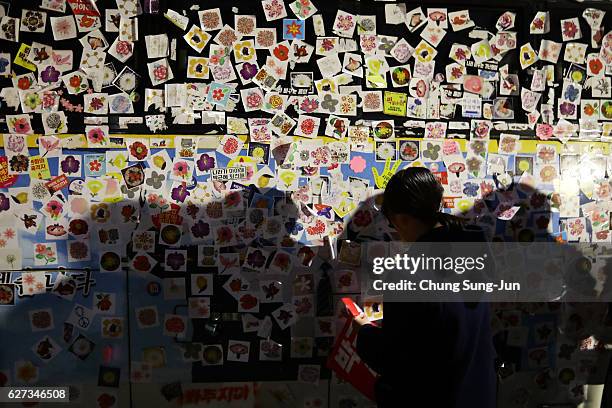 Protesters gather and occupy major streets in the city center for a rally against South Korean President Park Geun-hye on December 3, 2016 in Seoul,...