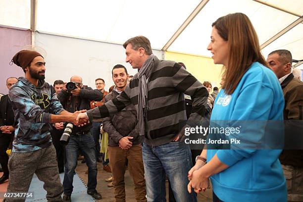 Slovenian President Borut Pahor meets staff at Makani's gym, run by Unicef, during his visit to the Zaatari refugee camp on December 3, 2016 near Al-...