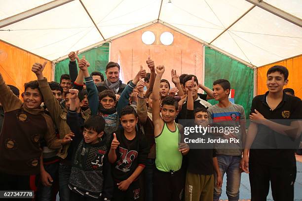 Slovenian President Borut Pahor meets Syrian refugee children during their exercise at Makani's gym, run by Unicef, during his visit to the Zaatari...