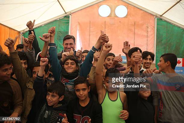 Slovenian President Borut Pahor meets Syrian refugee children during their exercise at Makani's gym, run by Unicef, during his visit to the Zaatari...