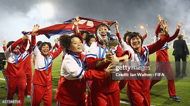 Korea DPR players celebrat with the trophy after winning the FIFA U-20 Women's World Cup, Final match between Korea DPRand France at the National...