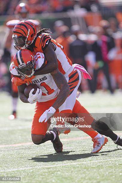 Terrelle Pryor Sr. #11 of the Cleveland Browns runs the football upfield against Darqueze Dennard of the Cincinnati Bengals during their game at Paul...