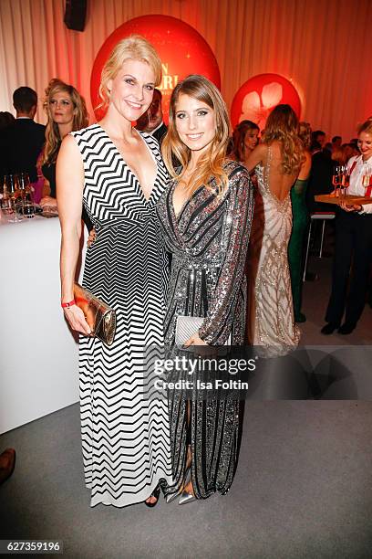 Natascha Gruen and Catherine Hummels attend the Mon Cheri Barbara Tag at Postpalast on December 2, 2016 in Munich, Germany.