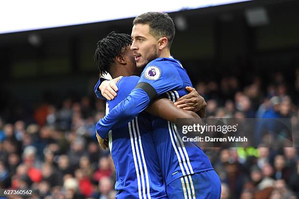 Eden Hazard of Chelsea celebrates scoring his team's third goal with his team mate Nathaniel Chalobah during the Premier League match between...