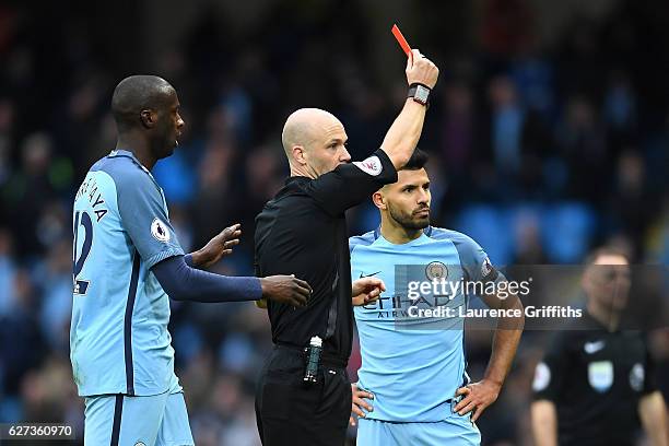 Sergio Aguero of Manchester City is shown a red card by referee Anthony Taylor after fouling David Luiz of Chelsea during the Premier League match...