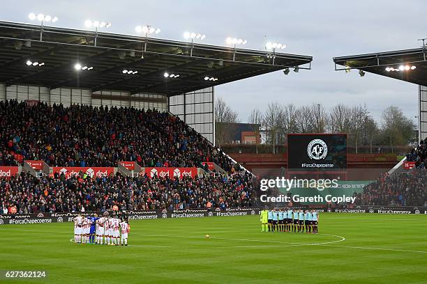 Fans, players and officials observe a minutes silence for the victims of the plane crash involving the Brazilian club Chapecoense prior to the...