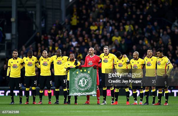 Watford players observe a minutes silence for the victims of the plane crash involving the Brazilian club Chapecoense prior the Premier League match...