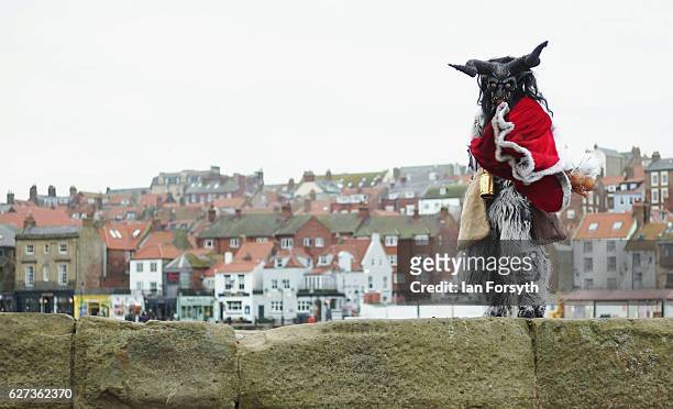 Lawerence Mitchell from Whitby dresses as the folklore figure, Krampus, ahead of a charity event on December 3, 2016 in Whitby, United Kingdom. The...
