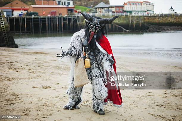 Lawerence Mitchell from Whitby dresses as the folklore figure, Krampus, ahead of a charity event on December 3, 2016 in Whitby, United Kingdom. The...