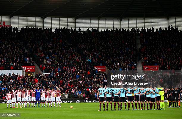 Fans, players and officials observe a minutes silence for the victims of the plane crash involving the Brazilian club Chapecoense prior to the...