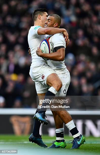 Jonathan Joseph of England celebrates scoring his sides first try with Ben Youngs of England during the Old Mutual Wealth Series match between...