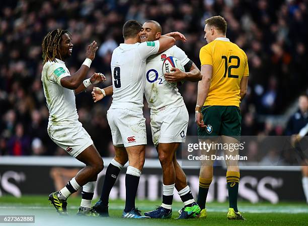 Jonathan Joseph of England celebrates scoring his sides first try with Ben Youngs of England during the Old Mutual Wealth Series match between...