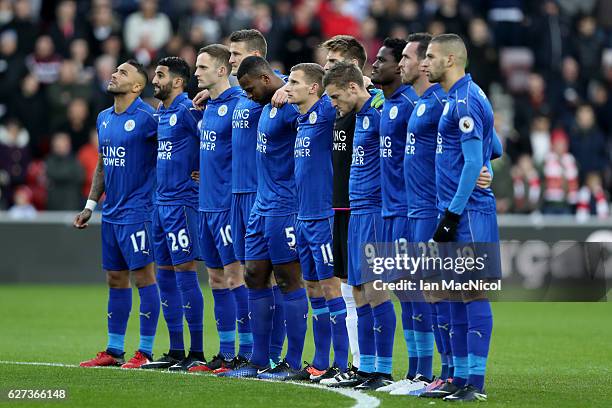 Leicester City players observe a minutes silence for the victims of the plane crash involving the Brazilian club Chapecoense prior to the Premier...