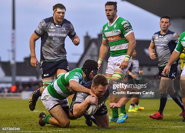 Galway , Ireland - 3 December 2016; Tom McCartney of Connacht scores his side's third try despite the tackle of Ian McKinley of Treviso during the...