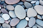 Abstract smooth round pebbles sea texture background