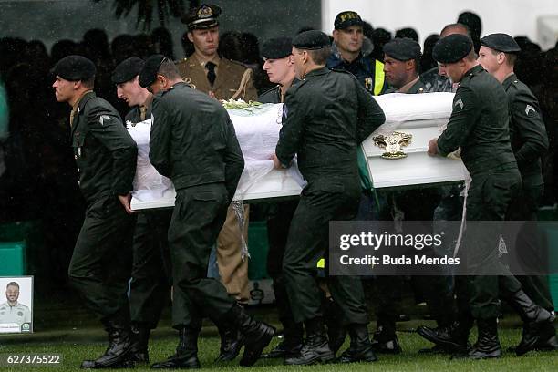 Air Force troops carry coffin of one of the victims of the plane crash in Colombia at the Arena Conda stadium on December 03, 2016 in Chapeco,...