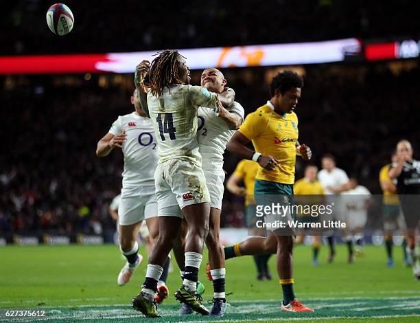 Jonathan Joseph of England celebrates scoring his sides fourth try with Marland Yarde of England during the Old Mutual Wealth Series match between...