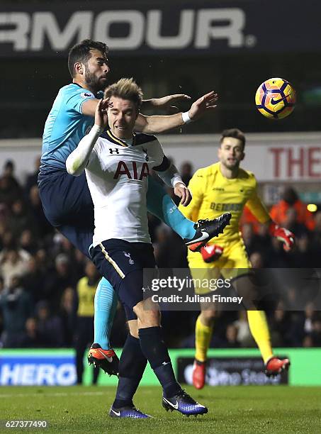 Christian Eriksen of Tottenham Hotspur scores his team's fourth goal during the Premier League match between Tottenham Hotspur and Swansea City at...