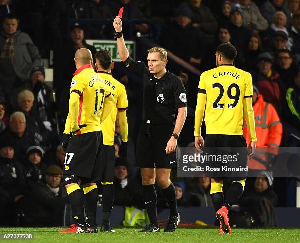 Roberto Pereyra of Watford is shown a red card by referee Graham Scott during the Premier League match between West Bromwich Albion and Watford at...