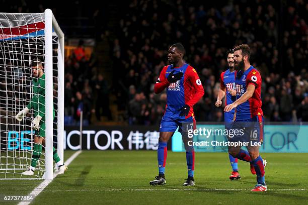 Christian Benteke of Crystal Palace celebrates scoring his team's third goal withi his team mate Joe Ledley during the Premier League match between...