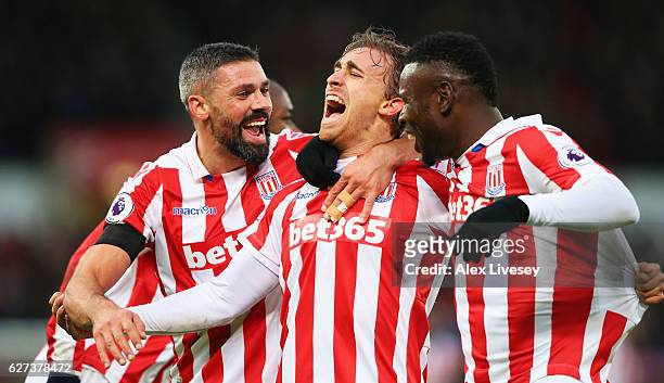 Marc Muniesa of Stoke City celebrates scoring his team's second goal with his team mates during the Premier League match between Stoke City and...