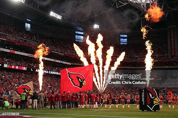 The Arizona Cardinals take the field before the start of the NFL football game against the San Francisco 49ers at University of Phoenix Stadium on...