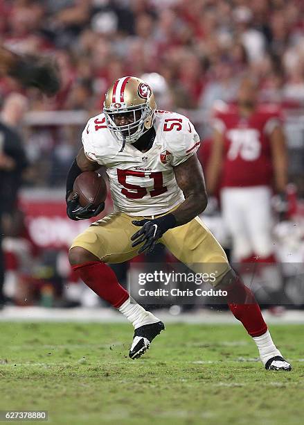 Inside linebacker Gerald Hodges of the San Francisco 49ers makes an interception during the second half of the NFL football game against the Arizona...