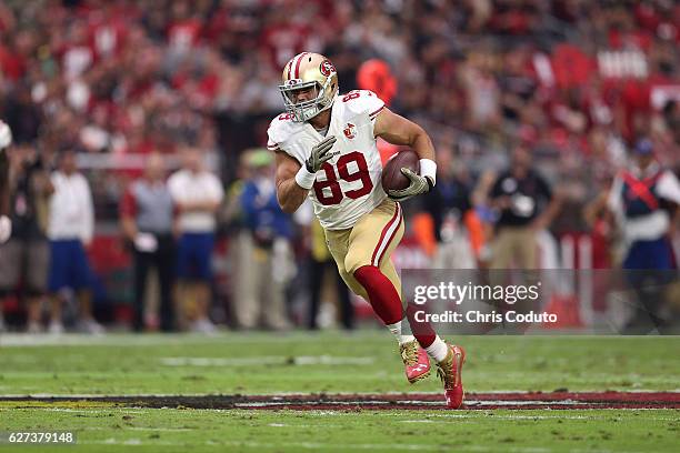 Tight end Vance McDonald of the San Francisco 49ers runs up field during the first half of the NFL football game against the Arizona Cardinals at...